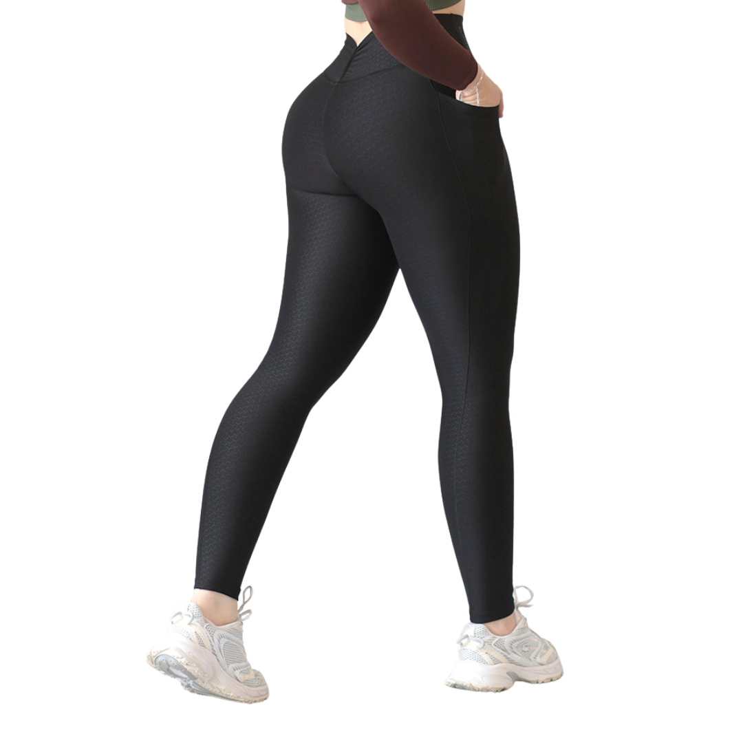 Leggings deportivos para mujer, efecto básico con cintura alta, bolsillos laterales y textil lycra transpirable con relieves de red. Color negro | Adriana Olimpo
