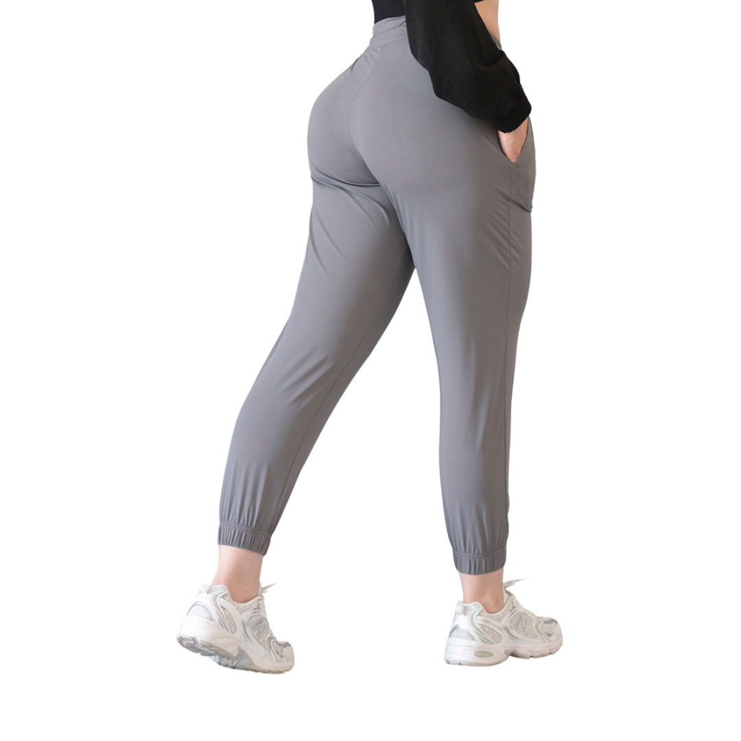 Joggers Deportivos para Mujer Fitness: Efecto Básico, Cintura Alta, Con Bolsillos Laterales, Textil Lycra Transpirable con Acabado Liso, Color Gris | Adriana Olimpo
