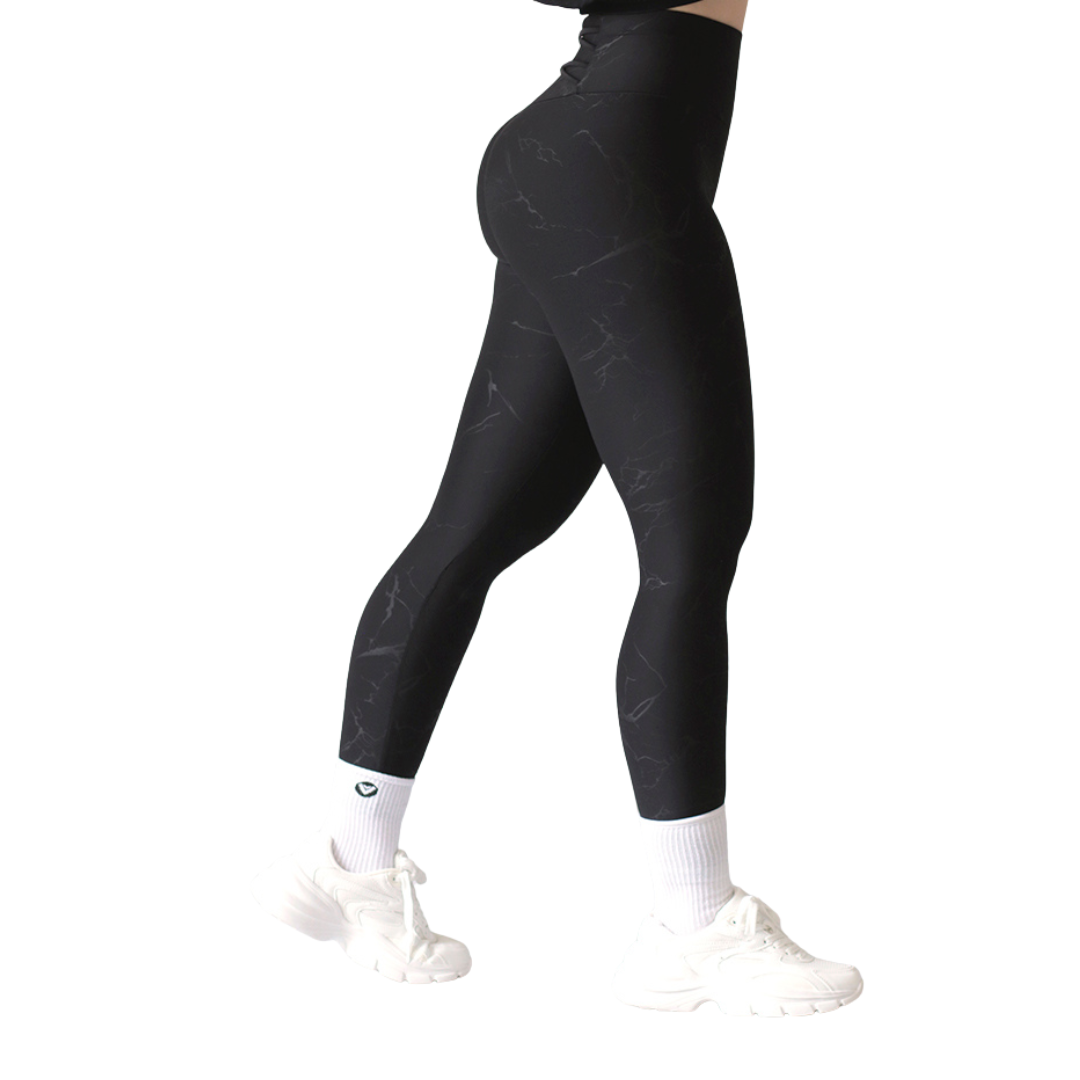 Leggings deportivos supplex para mujer, efecto push up con cintura alta, textil lycra transpirable con relieves de rayos. Color negro | Adriana Olimpo