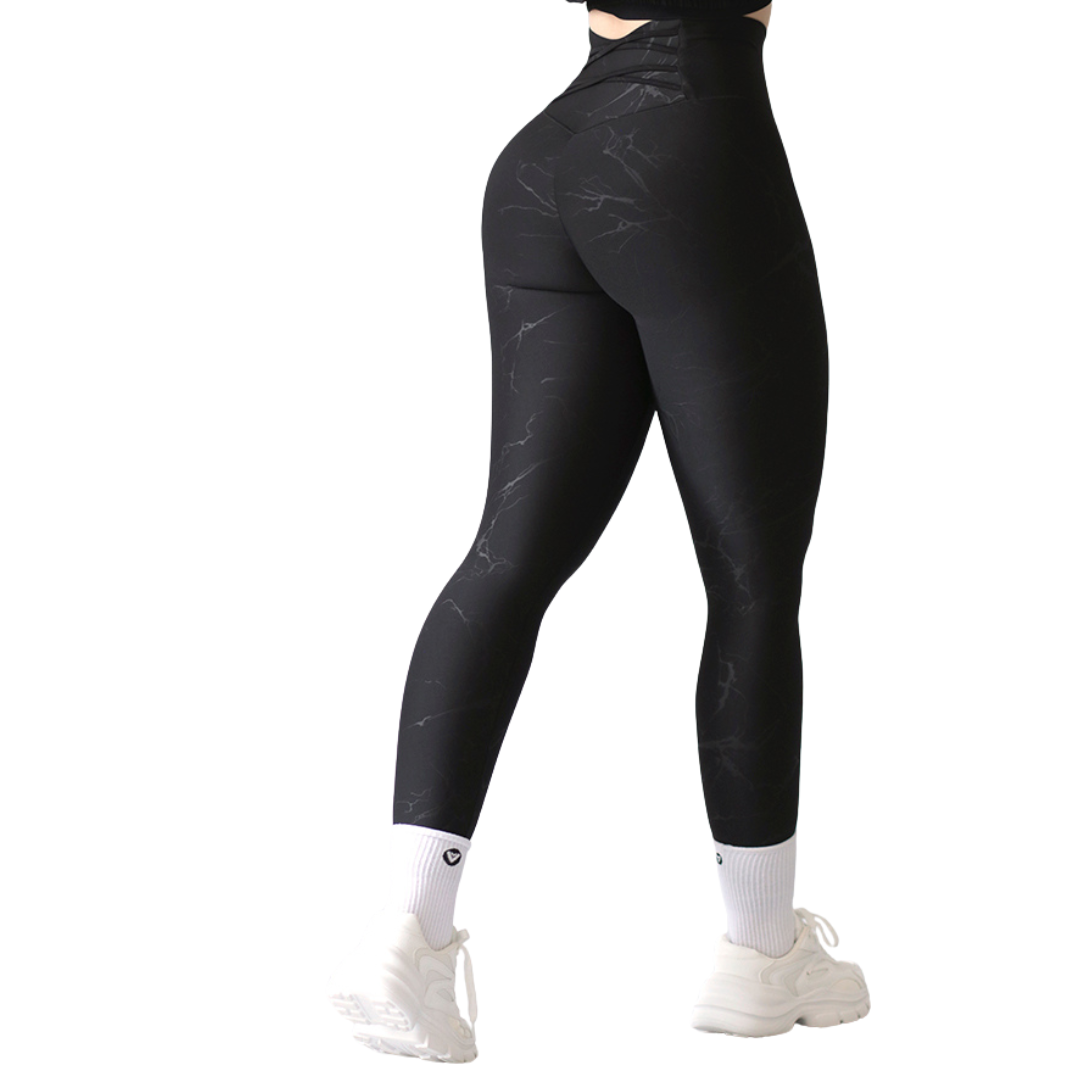 Leggings deportivos supplex para mujer, efecto push up con cintura alta, textil lycra transpirable con relieves de rayos. Color negro | Adriana Olimpo