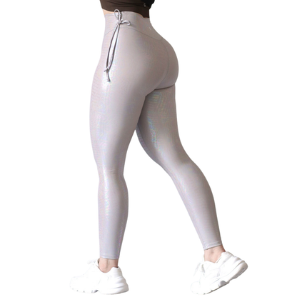 Leggings deportivos supplex para mujer, efecto básico con cintura alta, textil lycra transpirable con destellos ✨ y relieves de hops. Color gris| Adriana Olimpo