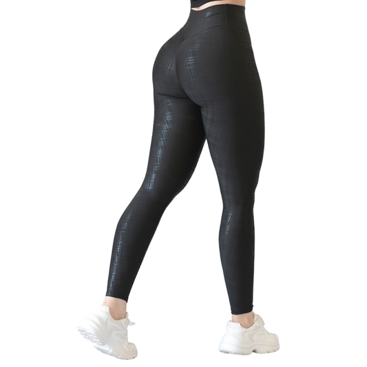 Leggings deportivos supplex para mujer, efecto push up con cintura alta, textil lycra transpirable con destellos ✨ y relieves de líneas. Color negro | Adriana Olimpo