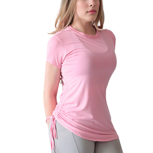 Blusa deportiva para mujer, manga corta con espalda en transparencia, textil lycra transpirable con acabado liso. Color rosa | Adriana Olimpo